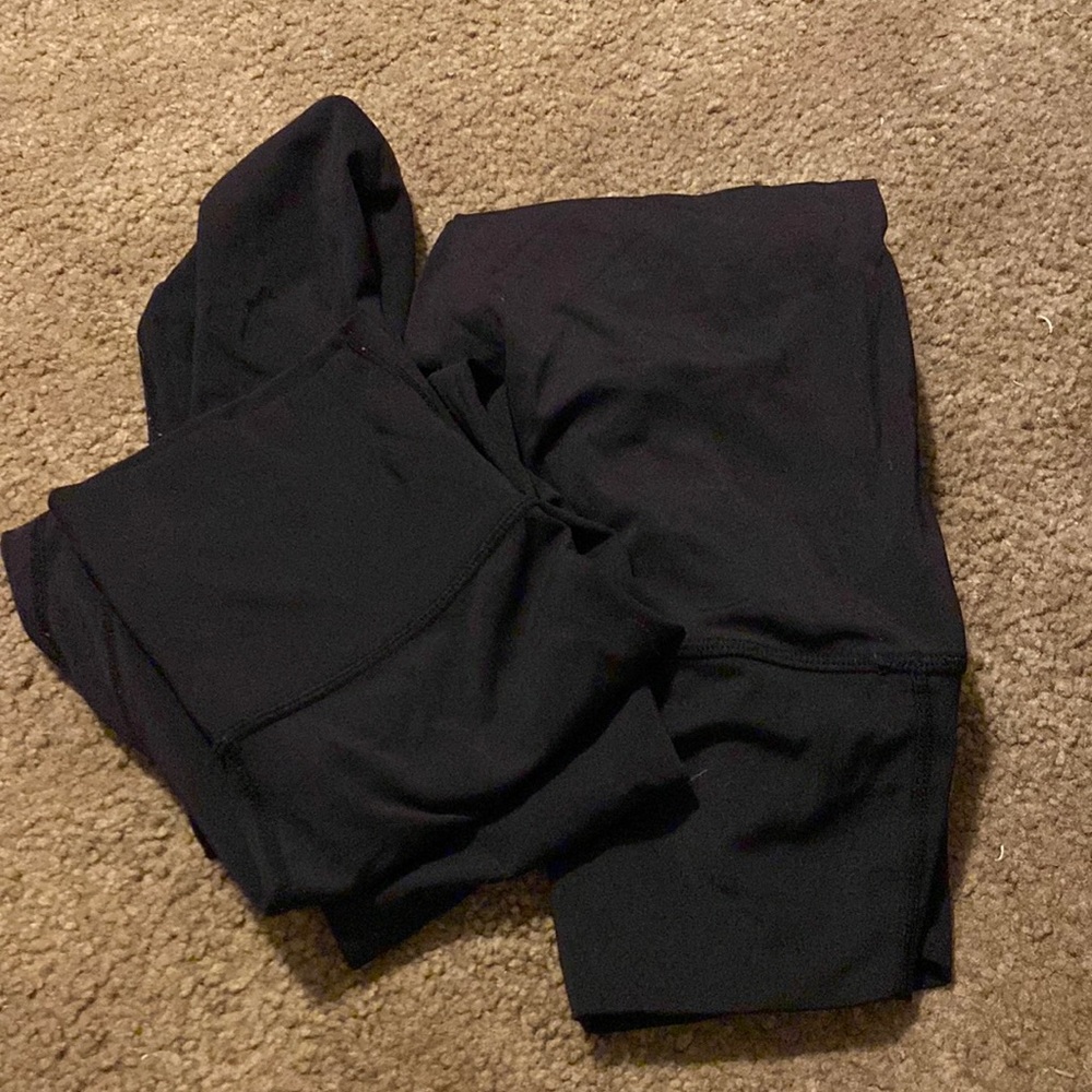 Two pairs of black colorfulkoala leggings.